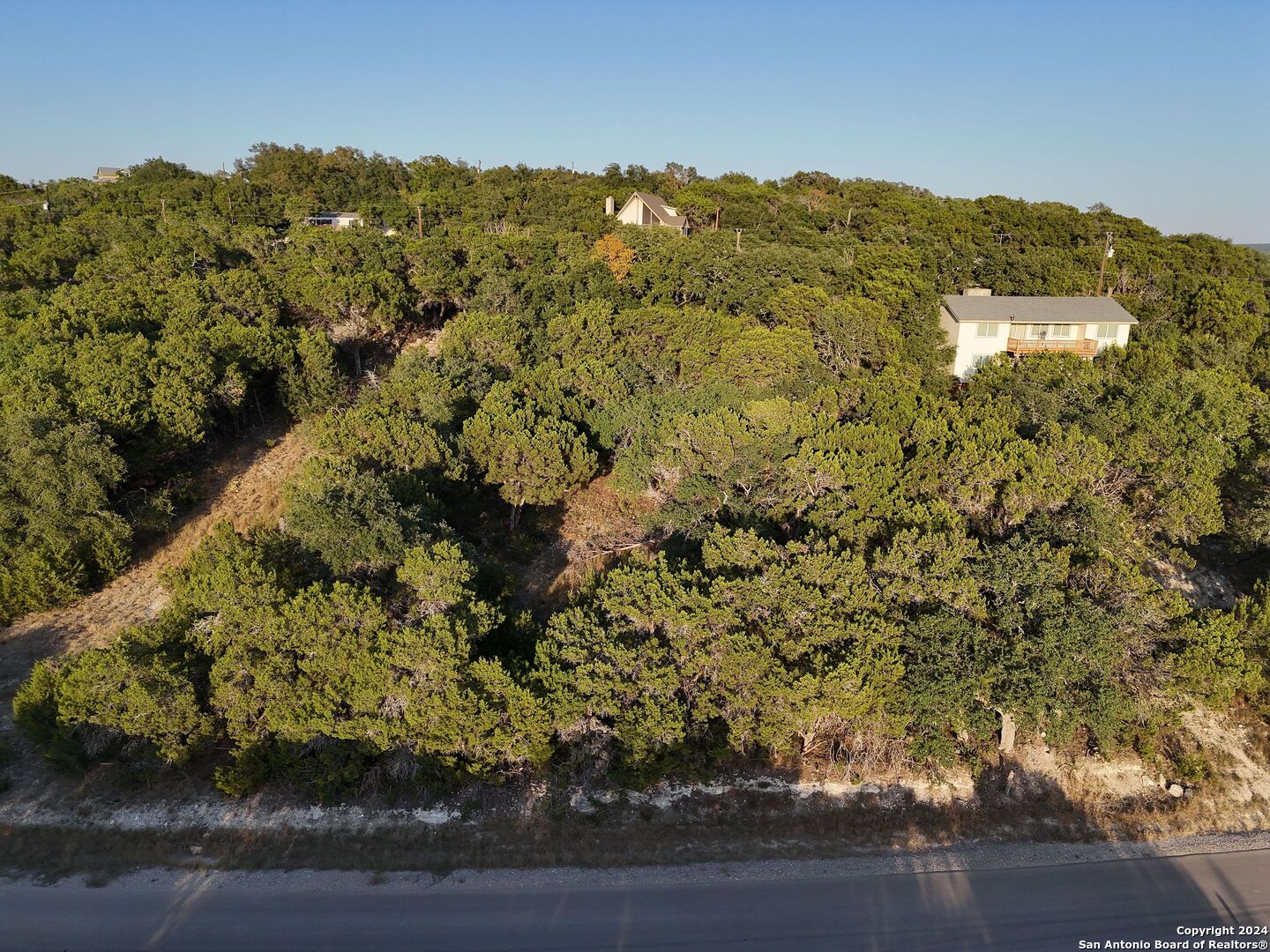 1167 Hancock Road Canyon Lake, TX 78133 - Photo 19 of 29 a view of a houses with a yard