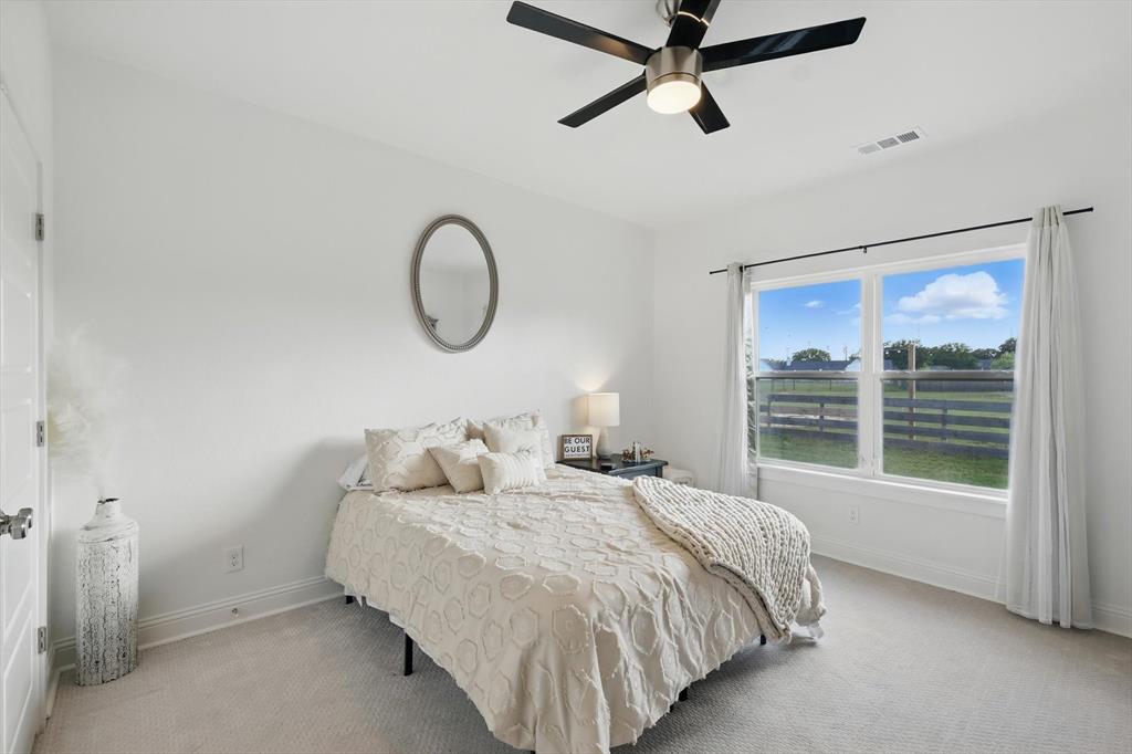 121 Bluegrass Trail Springtown, TX 76082 - Photo 22 of 39 a bedroom with bed and window