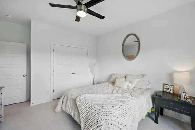 a bedroom with a bed and closet