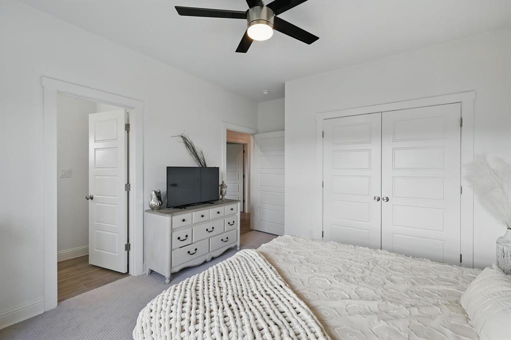 121 Bluegrass Trail Springtown, TX 76082 - Photo 24 of 39 a bedroom with a bed and a flat screen tv