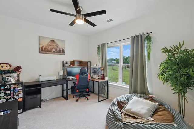 a workspace with furniture and a potted plant