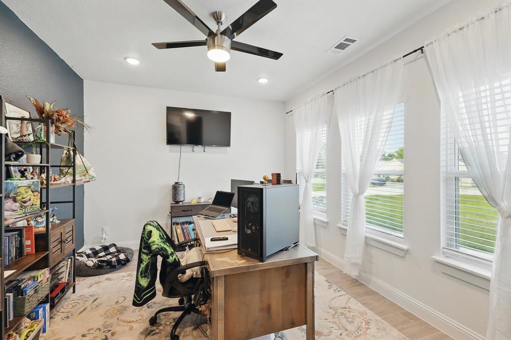 121 Bluegrass Trail Springtown, TX 76082 - Photo 30 of 39 a view of a workspace with furniture and a window