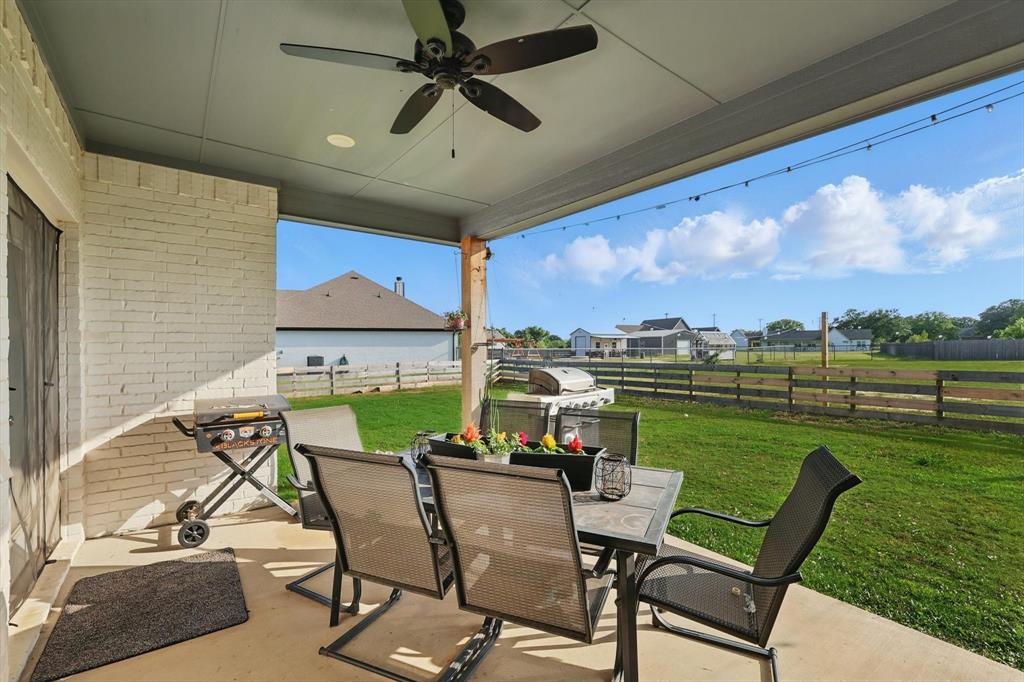 121 Bluegrass Trail Springtown, TX 76082 - Photo 31 of 39 a view of a chairs and table in patio