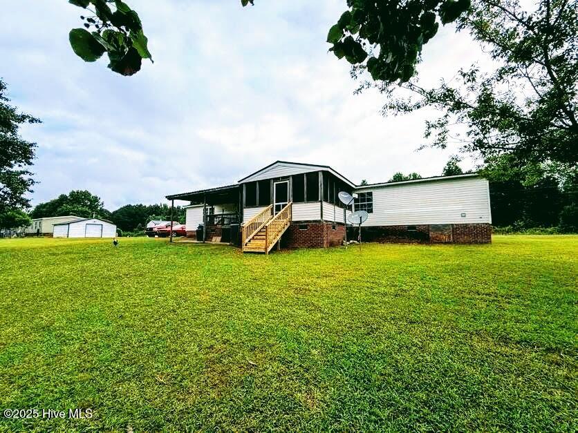 3682 Titan Roberts Road Erwin, NC 28339 - Photo 37 of 51 Back exterior view of screened porch and deck. 3682 Titan Roberts Rd. Erwin, NC