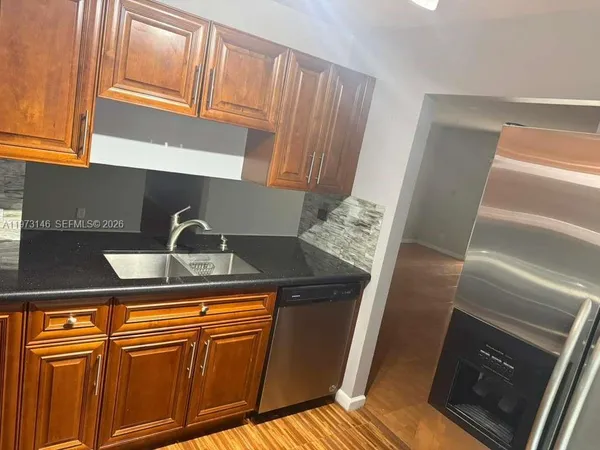 a close view of sink and washing machine