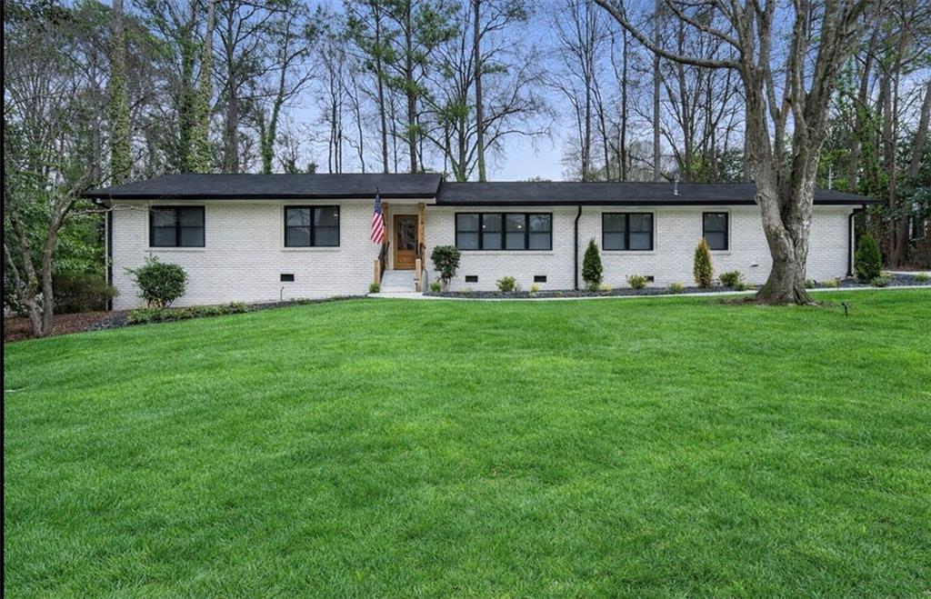 a front view of house with yard and seating area