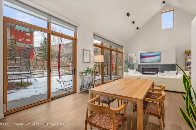 a spacious bedroom with a bed and a large window