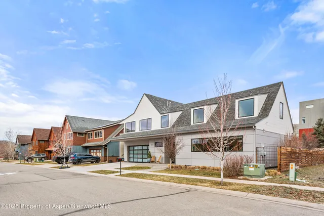 a view of a patio with table and chairs and potted plants