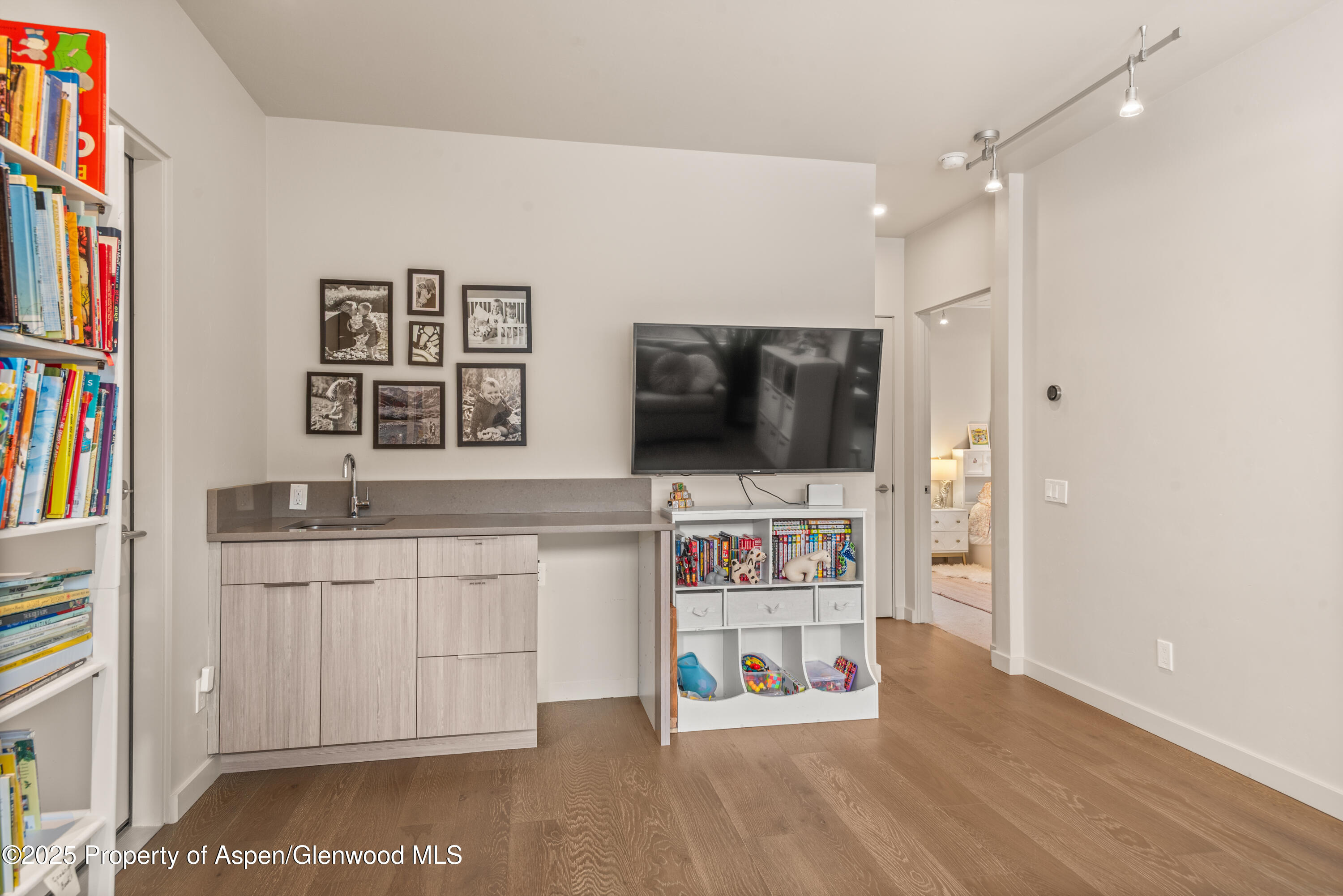 113 Valley Court Basalt, CO 81621 - Photo 23 of 34 a living room with stainless steel appliances kitchen island granite countertop a refrigerator oven a stove top oven a dining table and chairs with wooden floor
