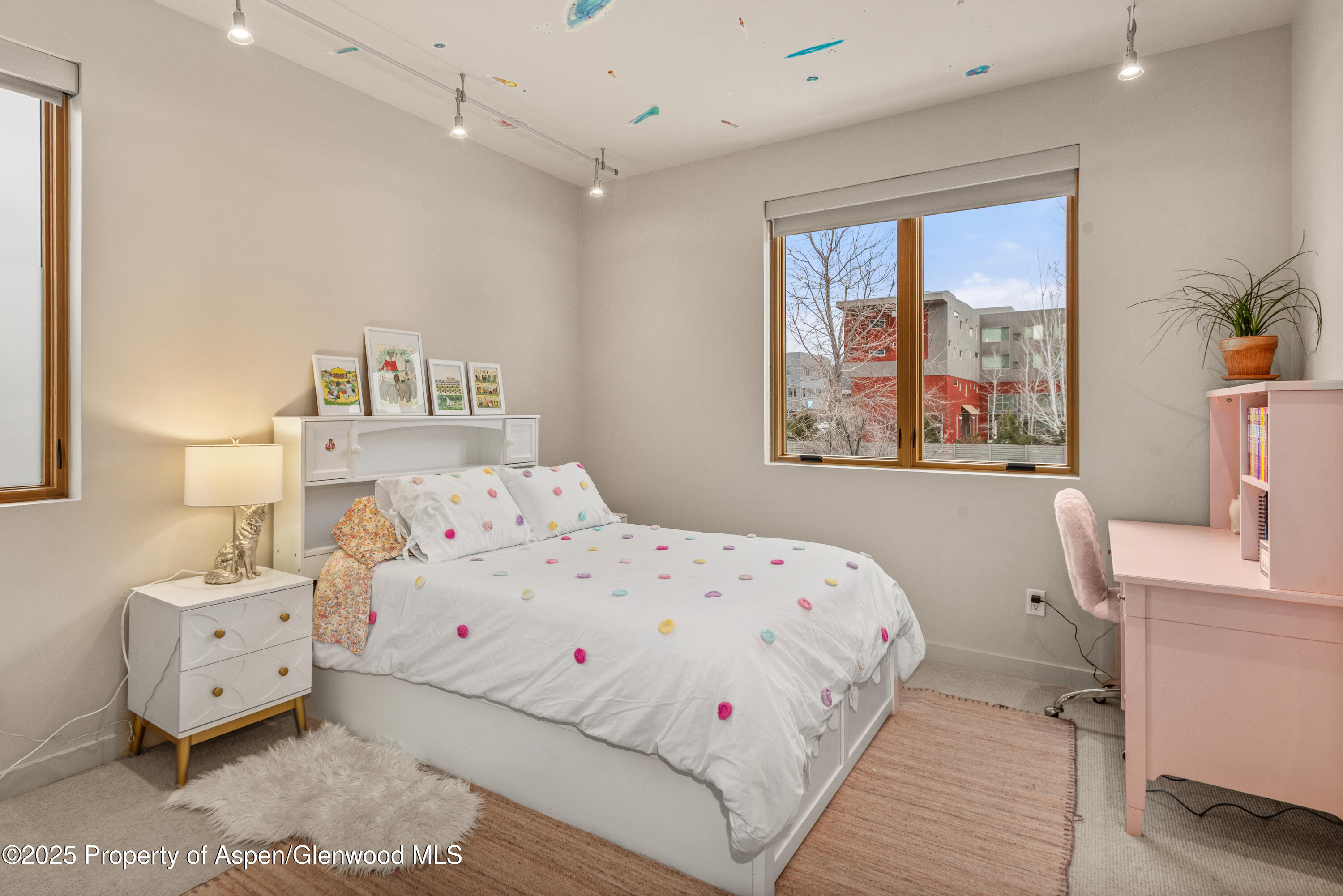 113 Valley Court Basalt, CO 81621 - Photo 24 of 34 a bedroom with a bed and a large window