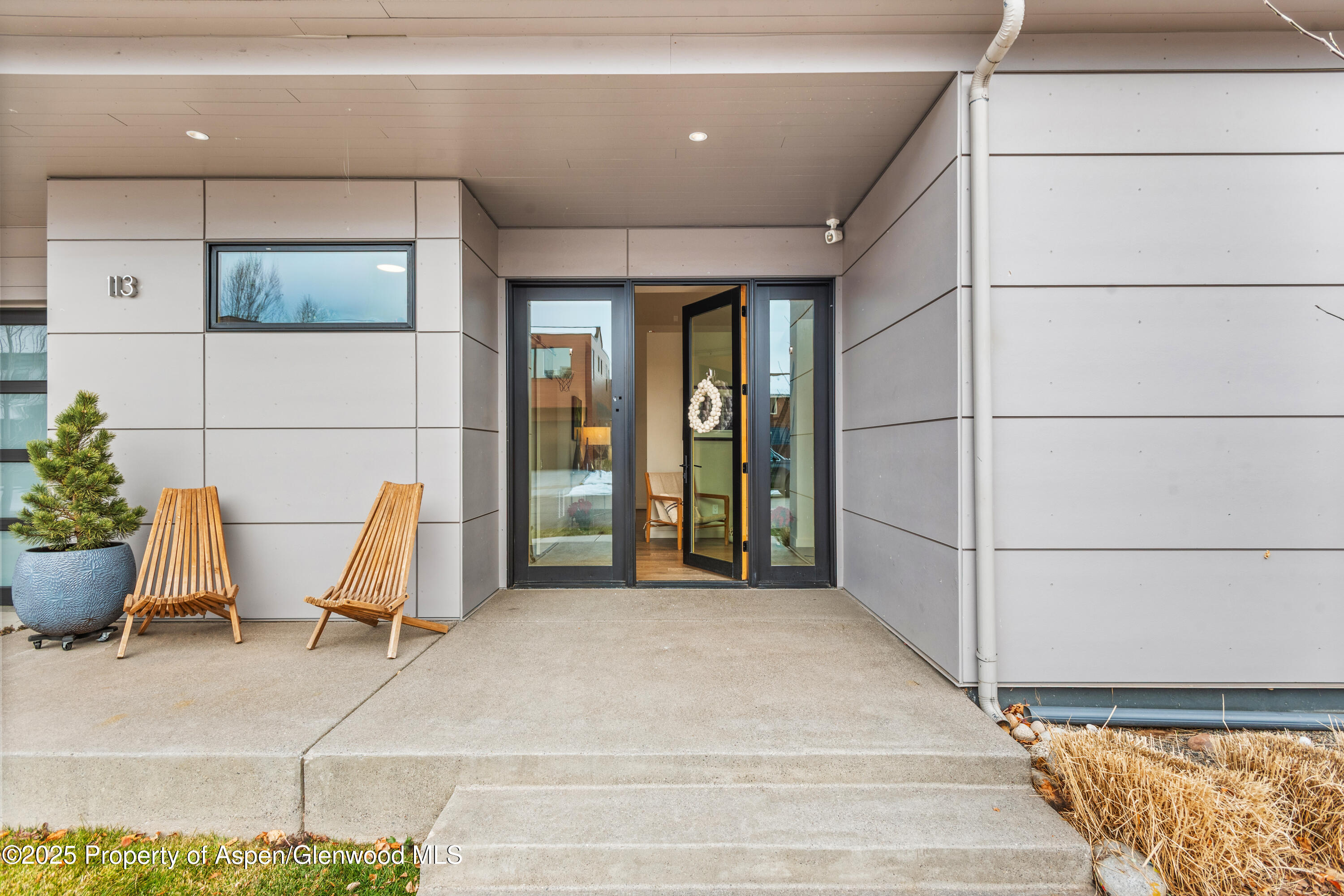 113 Valley Court Basalt, CO 81621 - Photo 4 of 34 a view of a patio with table and chairs and potted plants