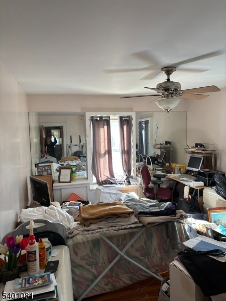 306 East 34th Street Paterson, NJ 07504 - Photo 11 of 12 a living room with furniture and a chandelier