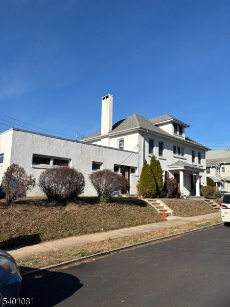 306 East 34th Street Paterson, NJ 07504 - Photo 2 of 12 a view of a house with a outdoor space