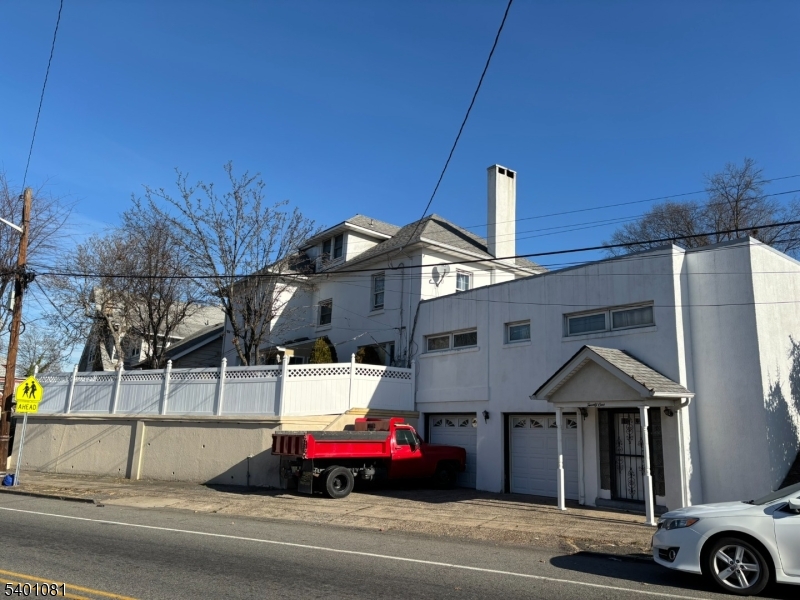 306 East 34th Street Paterson, NJ 07504 - Photo 3 of 12 a car parked in front of a house
