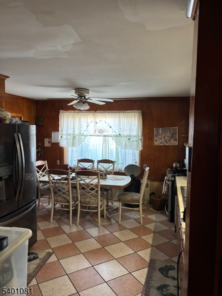306 East 34th Street Paterson, NJ 07504 - Photo 8 of 12 a view of a dining room with furniture window and outside view