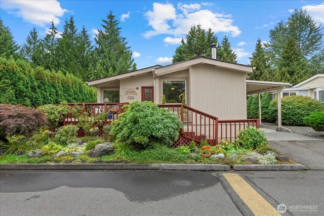 front view of a house with potted plants
