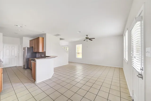 a view of a kitchen with kitchen island with furniture and window
