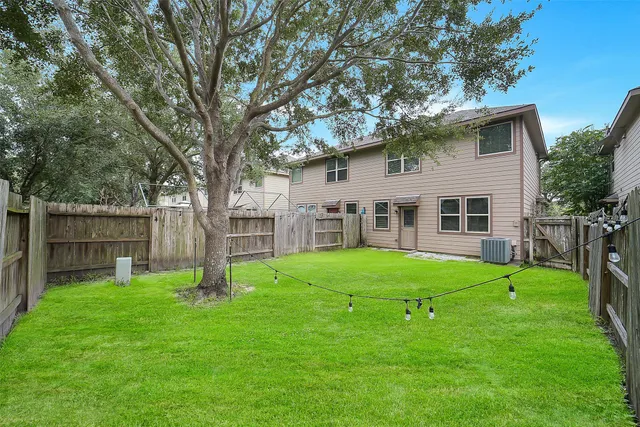 a view of a house with a backyard
