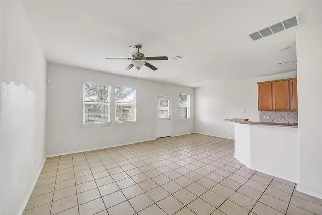 a view of an empty room with a window