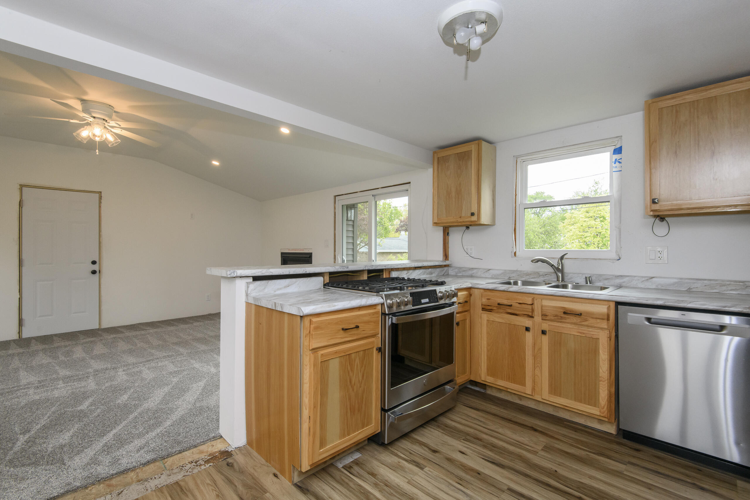 W271N2563 Pear Tree Lane Pewaukee, WI 53072 - Photo 7 of 47 Kitchen to family room