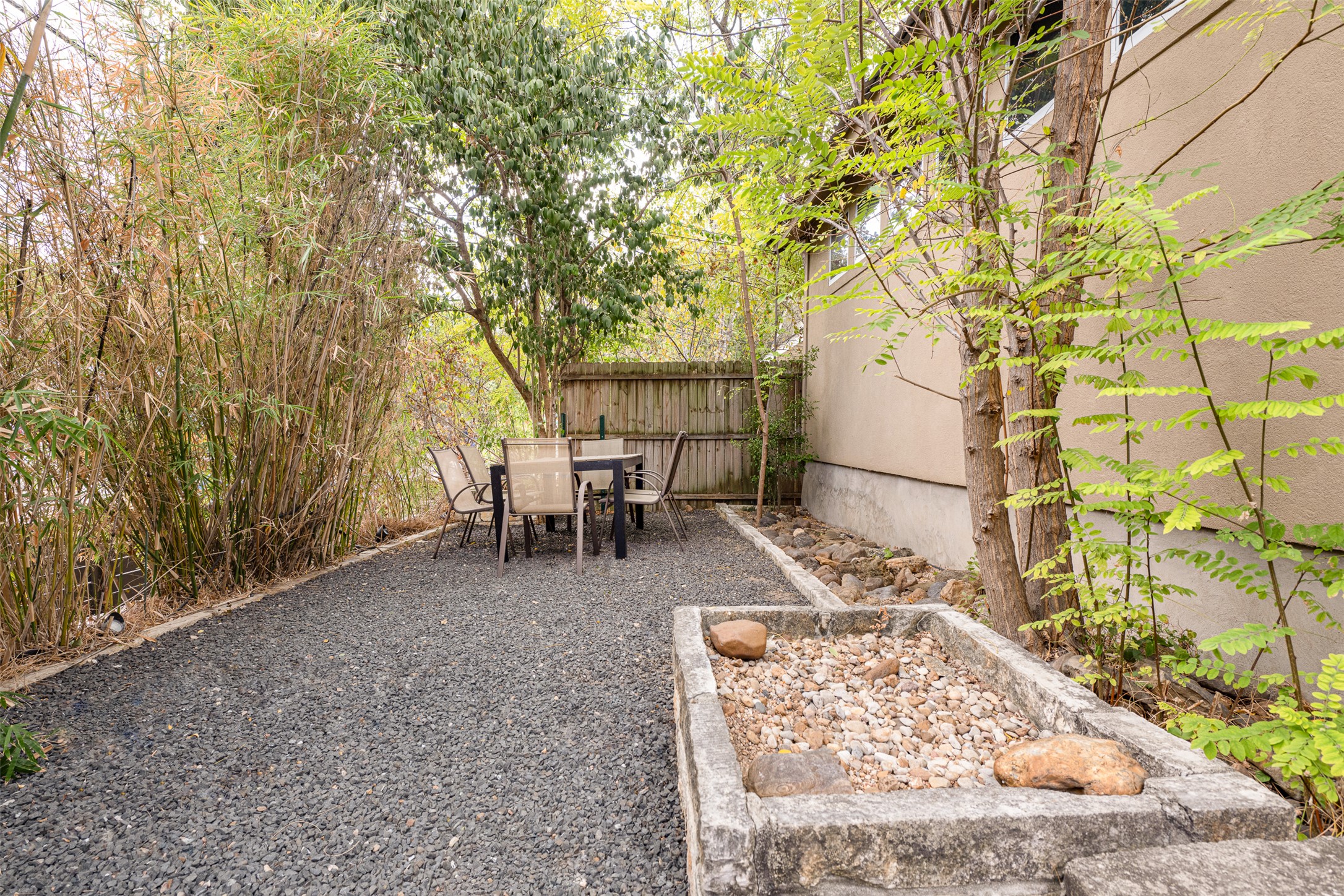 2302 East 9th Street Austin, TX 78702 - Photo 31 of 31 A tranquil outdoor dining space with natural privacy, perfect for alfresco meals.