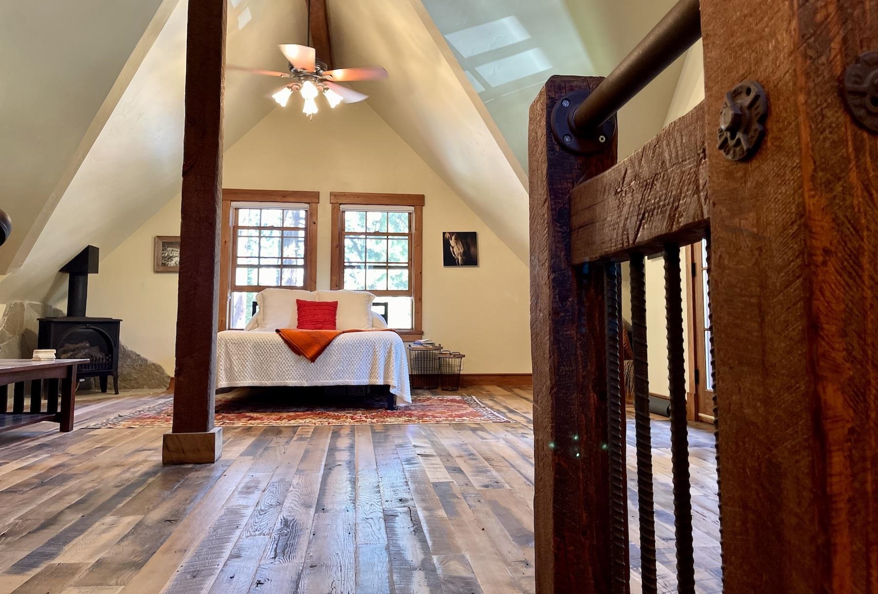 12726 Granite Drive Truckee, CA 96161 - Photo 14 of 21 a bedroom with a bed and wooden floor