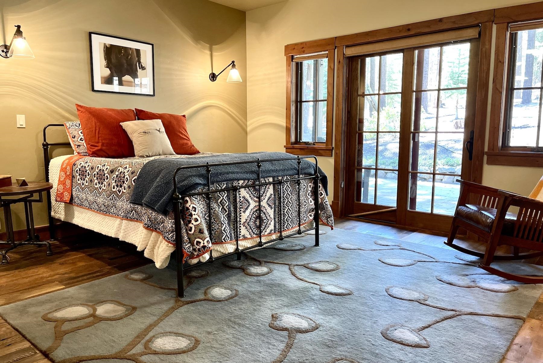 12726 Granite Drive Truckee, CA 96161 - Photo 16 of 21 a bedroom with a bed and wooden floor