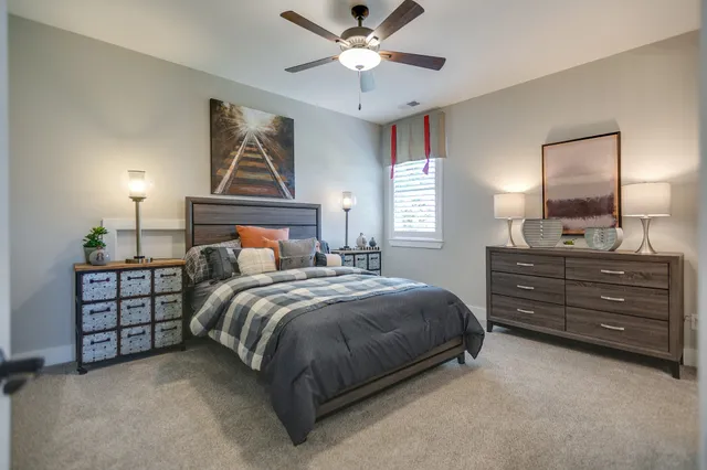 a bedroom with a bed and window