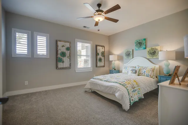 a bathroom with a double vanity sink mirror and shower