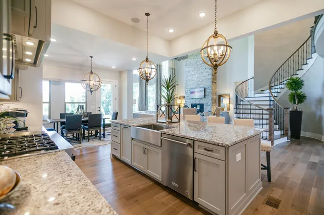 a large kitchen with lots of counter space and stainless steel appliances