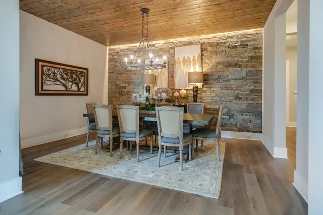a spacious bathroom with a bathtub sink and mirror
