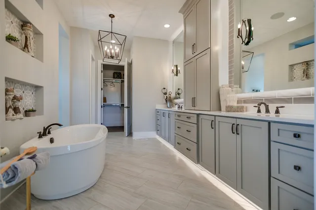 a white bath tub sitting in a bathroom