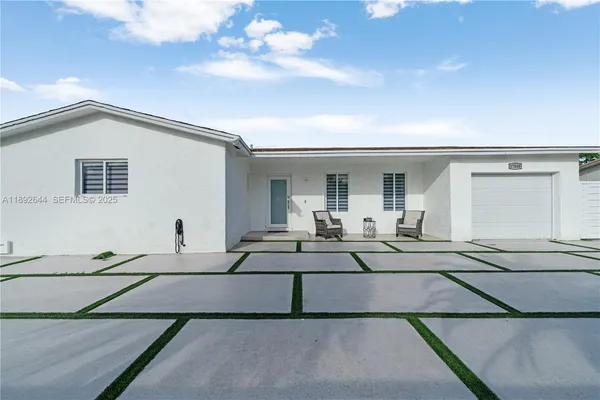 a view of a car park in front of house