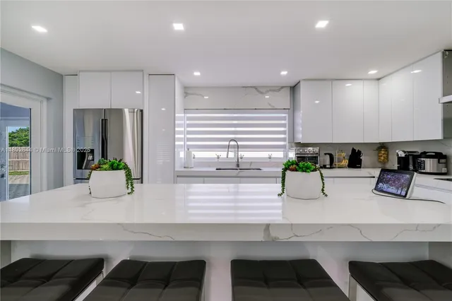 a kitchen with counter top space cabinets and stainless steel appliances