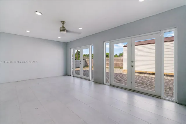 a view of backyard with potted plants