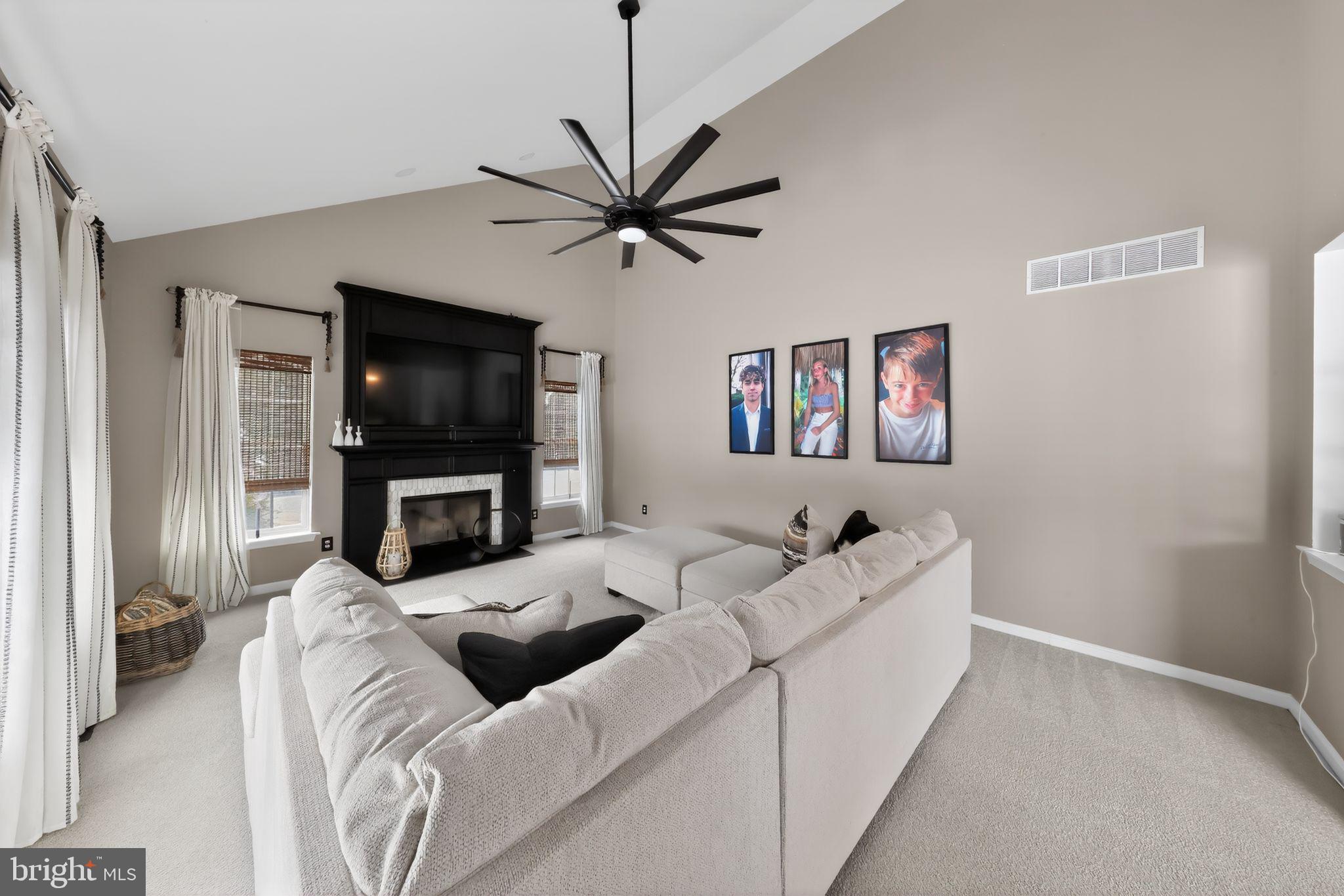 106 Coventry Lane Swedesboro, NJ 08085 - Photo 15 of 38 a living room with furniture and a flat screen tv