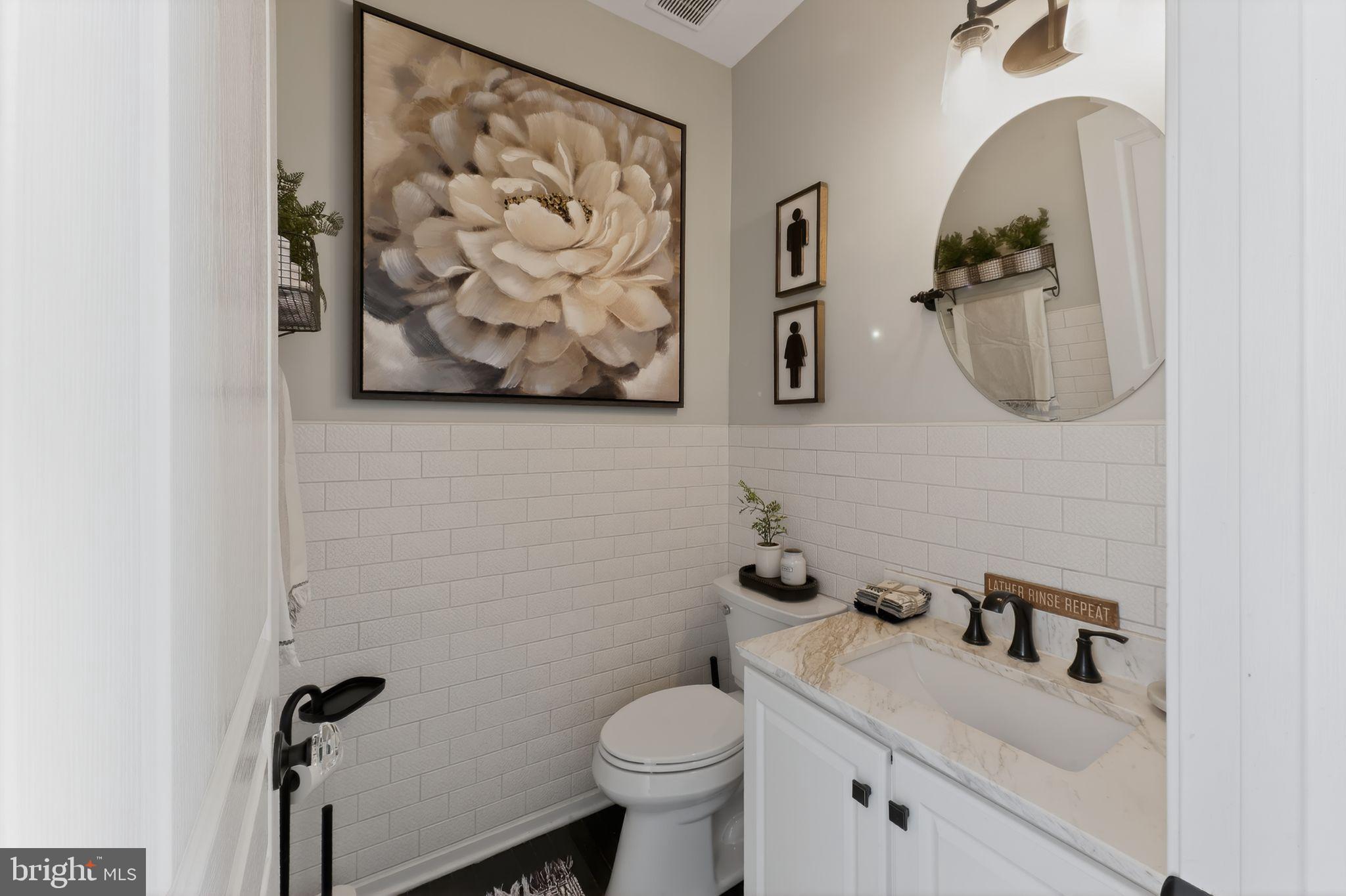 106 Coventry Lane Swedesboro, NJ 08085 - Photo 17 of 38 a bathroom with a toilet sink and mirror