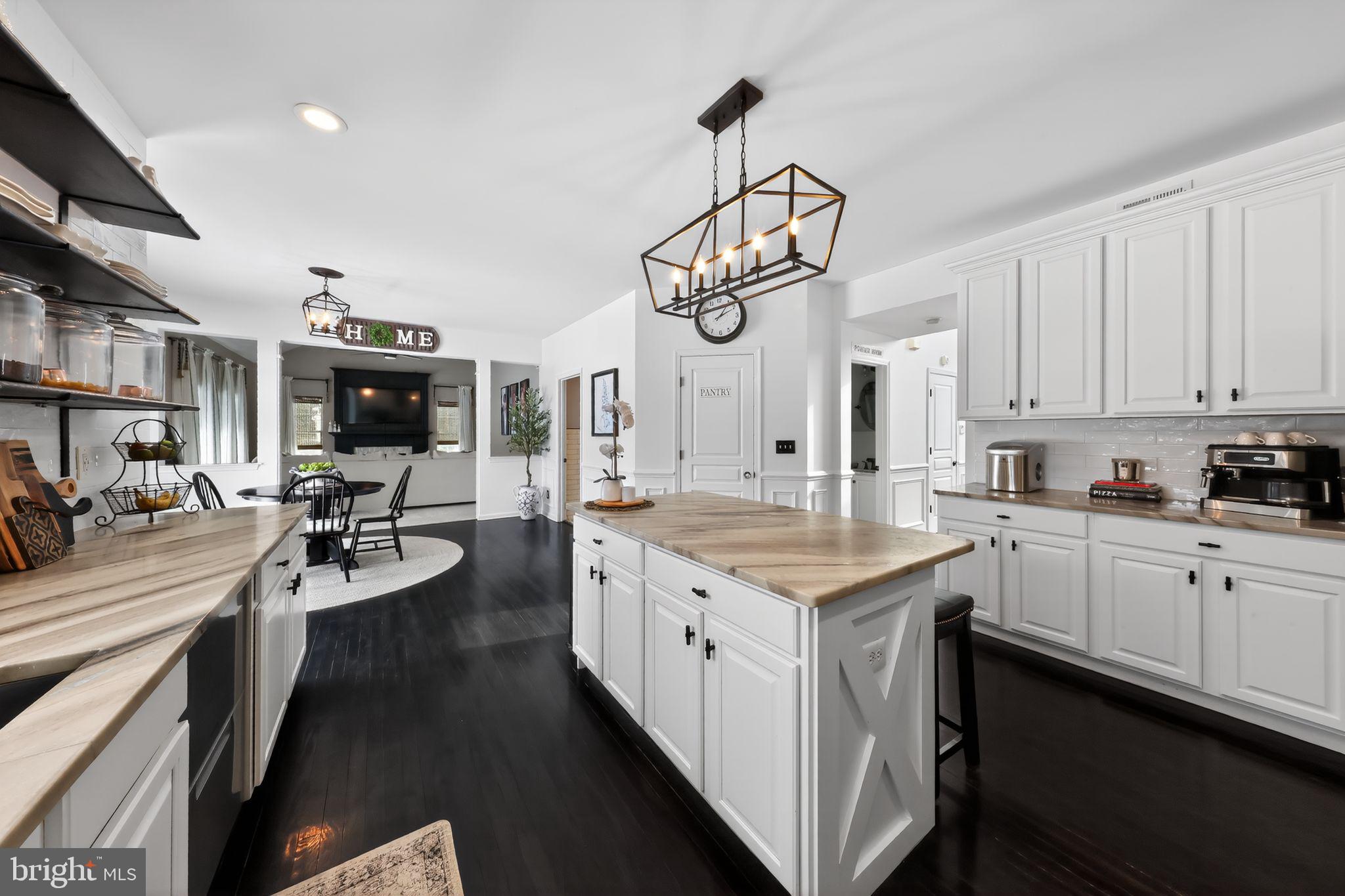 106 Coventry Lane Swedesboro, NJ 08085 - Photo 21 of 38 a kitchen with stainless steel appliances granite countertop a stove oven a sink dishwasher and white cabinets next to a window