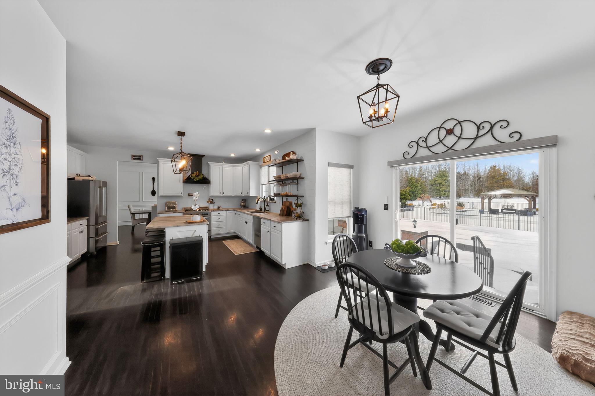 106 Coventry Lane Swedesboro, NJ 08085 - Photo 22 of 38 a view of a dining room with furniture and wooden floor