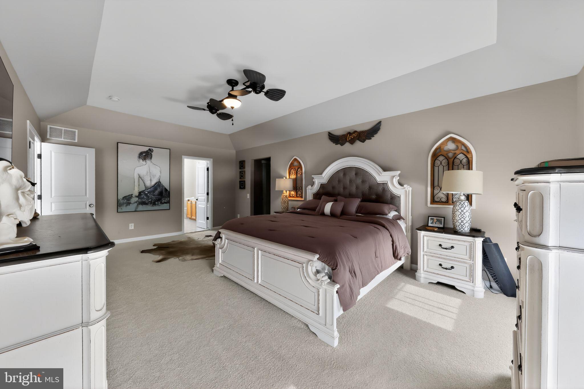 106 Coventry Lane Swedesboro, NJ 08085 - Photo 23 of 38 a spacious bedroom with a bed a couch and dresser