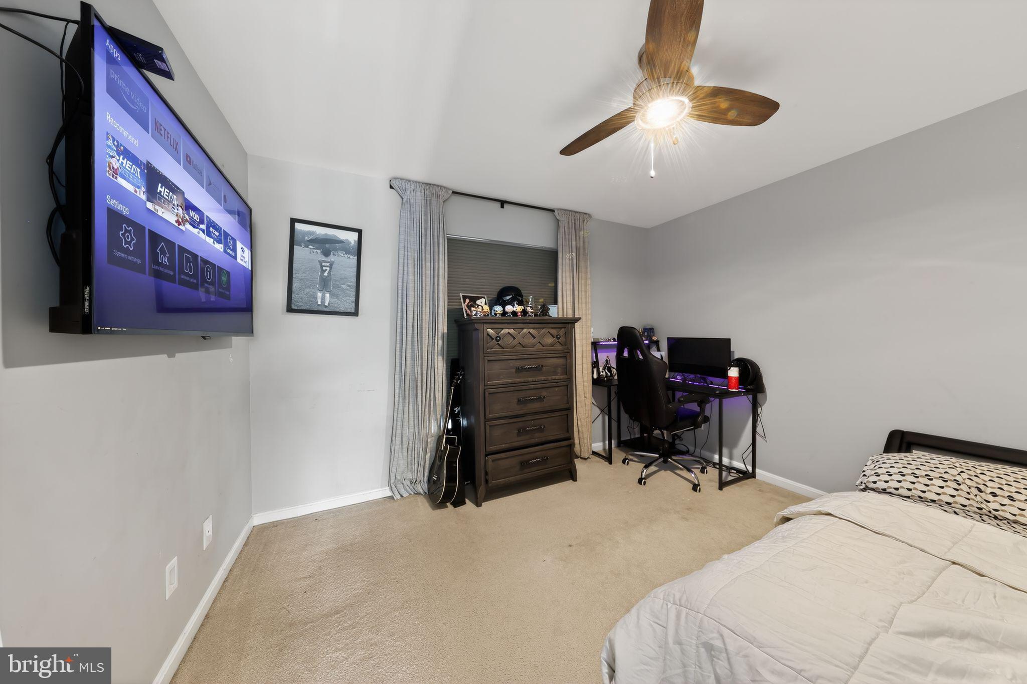 106 Coventry Lane Swedesboro, NJ 08085 - Photo 28 of 38 a bedroom with a bed and a chandelier