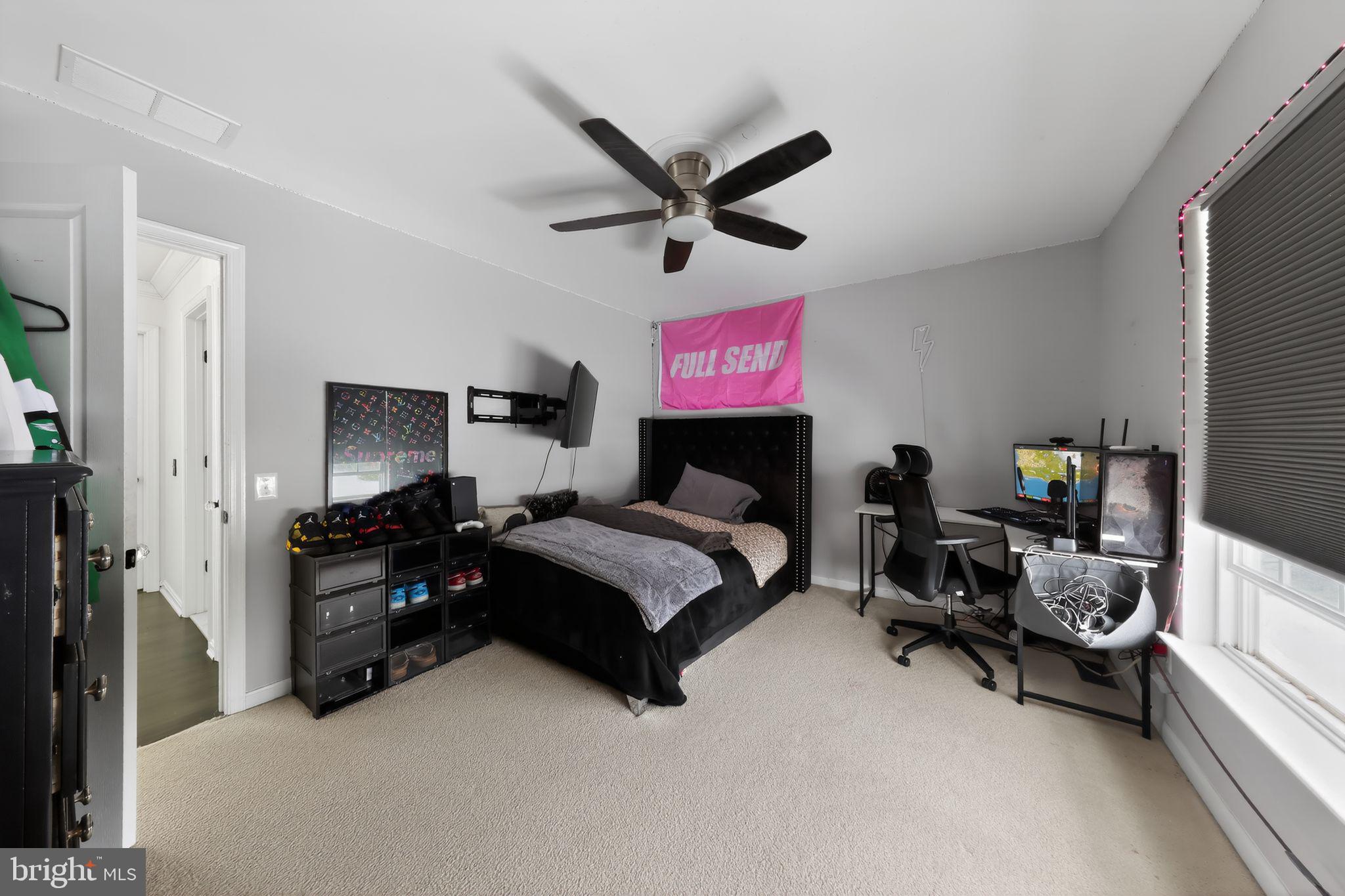 106 Coventry Lane Swedesboro, NJ 08085 - Photo 29 of 38 a bedroom with furniture and a flat screen tv
