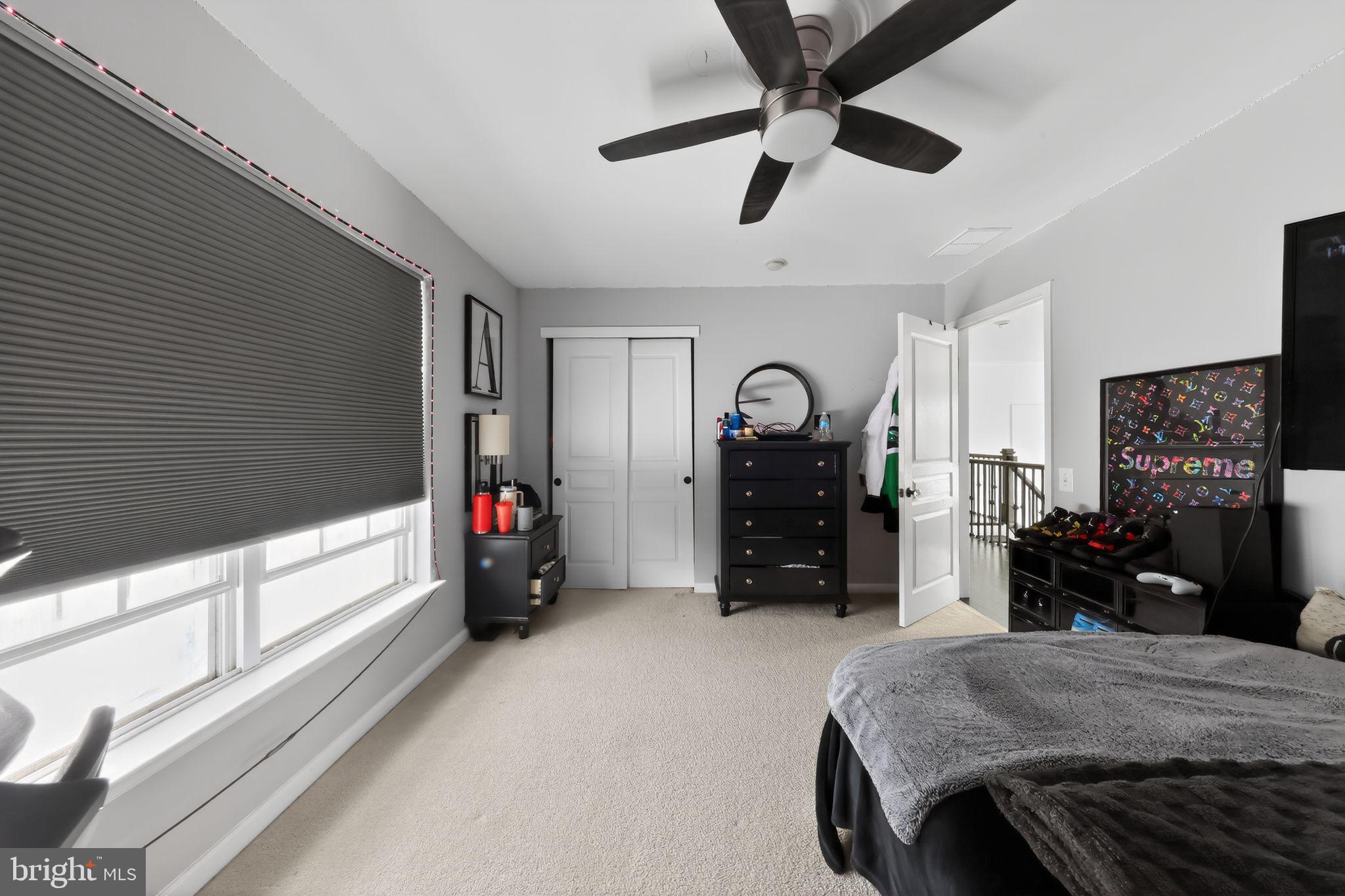 106 Coventry Lane Swedesboro, NJ 08085 - Photo 30 of 38 a living room with furniture and a flat screen tv