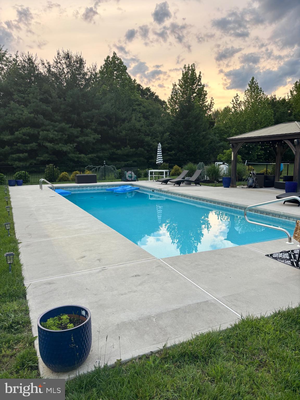 106 Coventry Lane Swedesboro, NJ 08085 - Photo 36 of 38 a view of a swimming pool with a yard