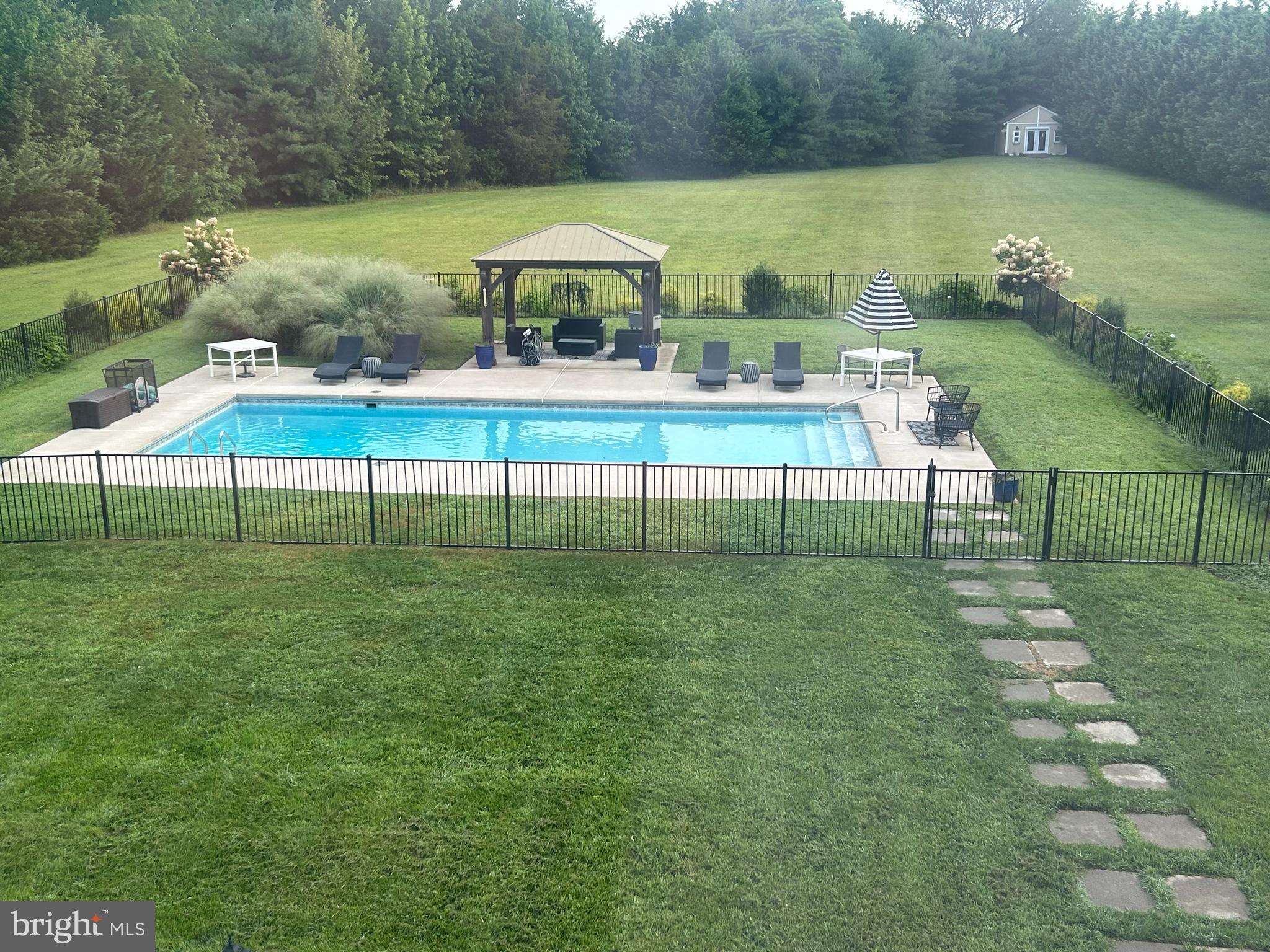 106 Coventry Lane Swedesboro, NJ 08085 - Photo 38 of 38 a view of a table and chairs in the garden
