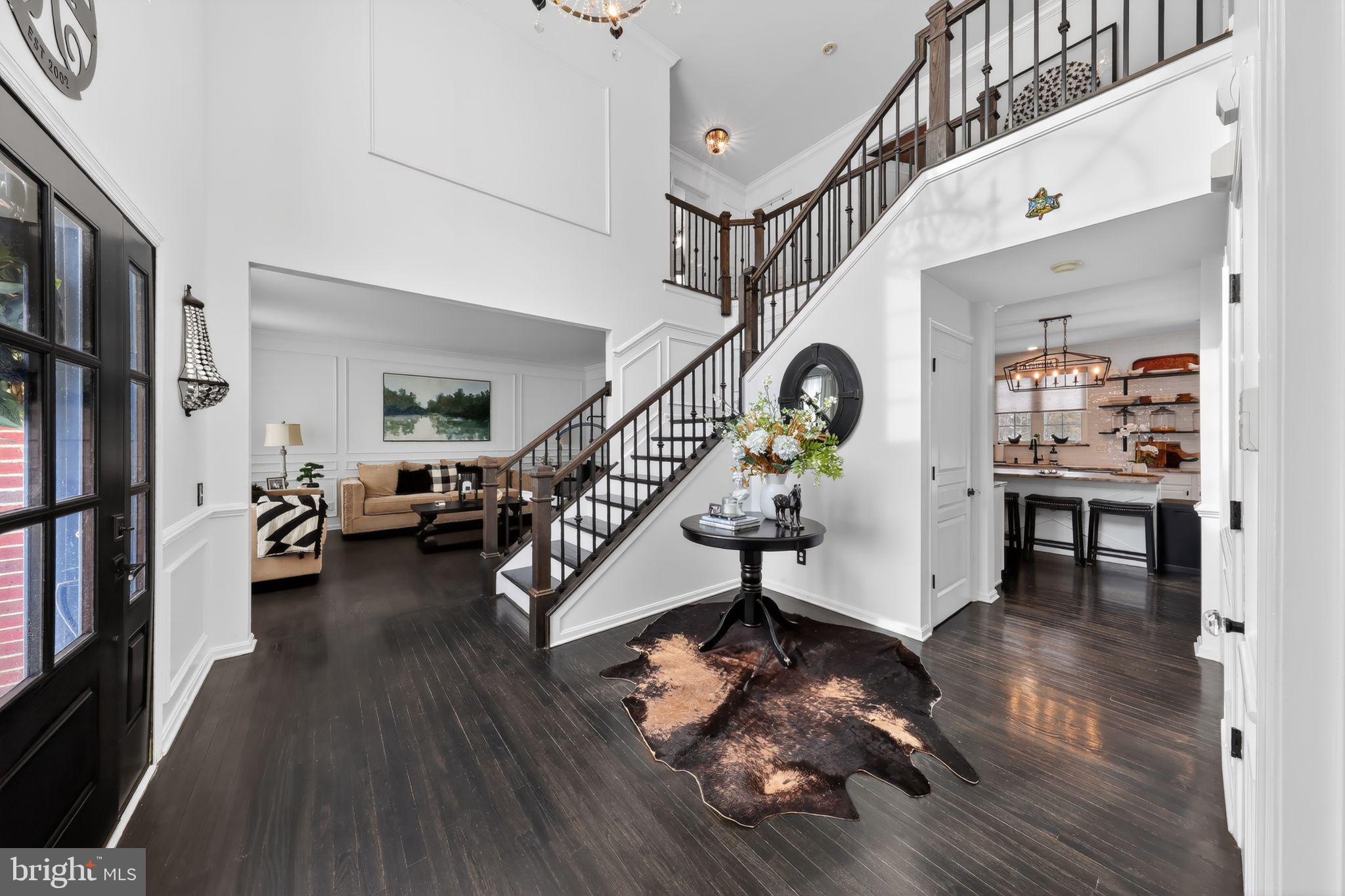 106 Coventry Lane Swedesboro, NJ 08085 - Photo 9 of 38 a view of entryway livingroom and hall with wooden floor