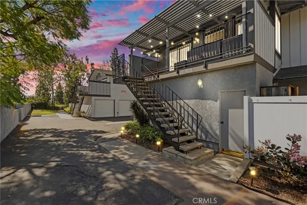 a view of a house with a street