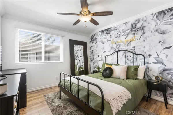 a bedroom with bed and a window