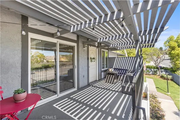 a view of balcony with wooden floor