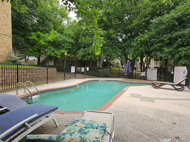 a view of a backyard with sitting area